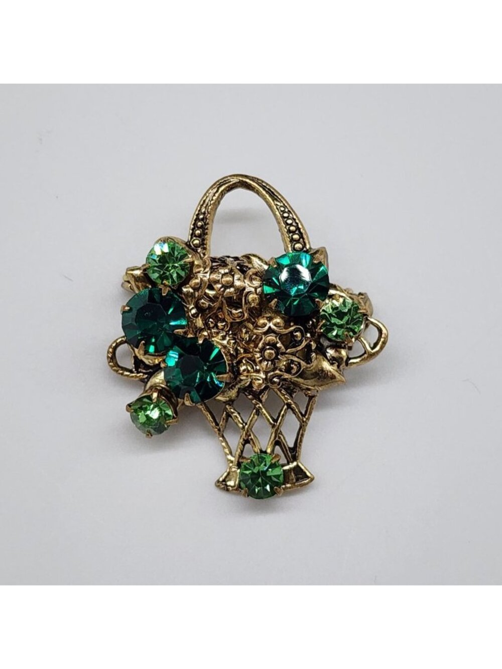 Vintage Gold Tone Basket Brooch With Green Rhinestone Floral Design